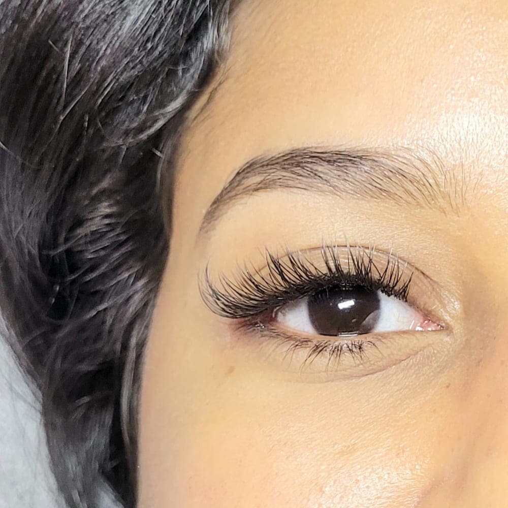 Lifted lashes and a defined brow, close up